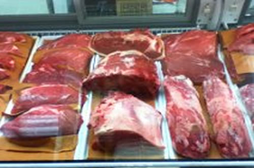A full butcher case of fresh meat
